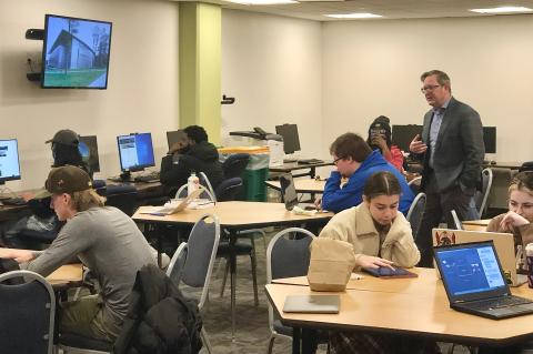 Dr. Nicholas J. Aieta, History and Philosophy Department Chair and Douglass Day Committee member (standing), fields questions during the Mary Ann Shadd Cary transcribe-a-thon, for WSU’s celebration of Douglass Day. (Staff photo)