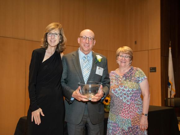 Former Chairman of Westfield State’s Board of Trustees and current member, Dr. Robert A. Martin was presented with an Honorary Alumnus Award from Framingham State University’s President Nancy Niemi, left, and President of the Alumni Association, Kelly Sardella Whitmore, right. (Framingham State University photo)