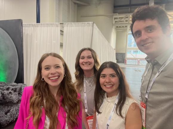 Students at the American Academy of Physician Assistants (AAPA) National Conference in Houston, Texas. They are posing with Hayley Arceneaux, a commercial astronaut and the first PA student to go to space.