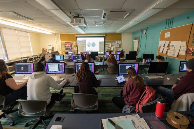 Dower 166 and 142 Computer Studios with students at computer stations.