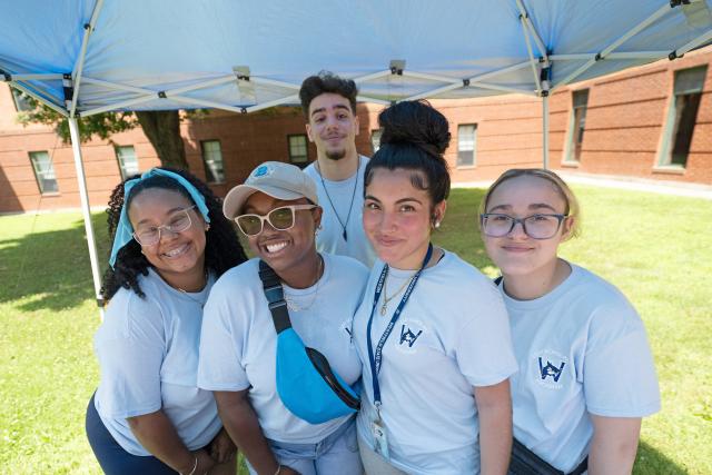 A group of LEAD Scholar students smile toward the camera at the beginning of the 2024 Summer Bridge Program.