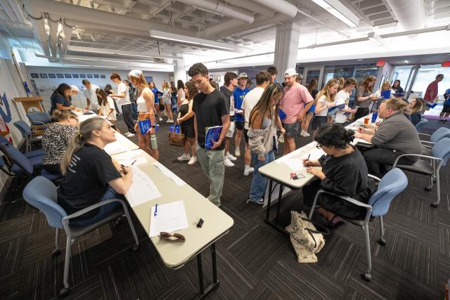 New Student Orientation resource tables with students, faculty, and staff.