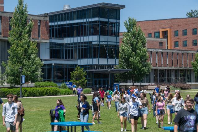 Group of new students gathered outside the Ely Campus Center.