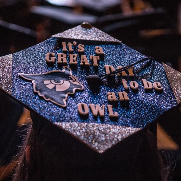 Graduation cap that says "It's a great day to be an owl"